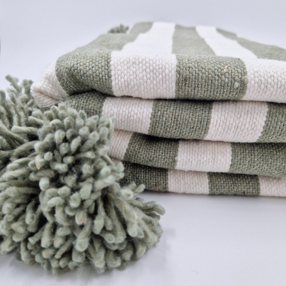 Handmade Moroccan Pompom Blanket in zebra style colors, light green and white with light green pompoms