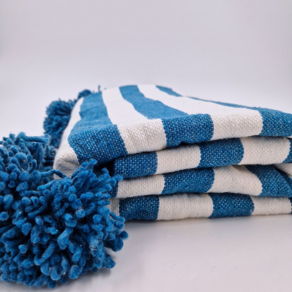 Handmade Moroccan Pompom Blanket in zebra style colors blue electric and white with blue pompoms