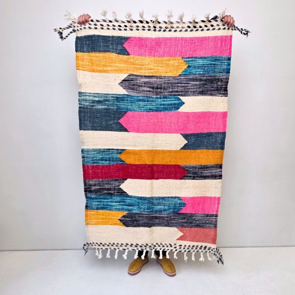Minimalistic Moroccan Azilal rug with bold geometric patterns in white, brown, blue and multicolor wool, featuring abstract Berber tribal motifs and handwoven texture.