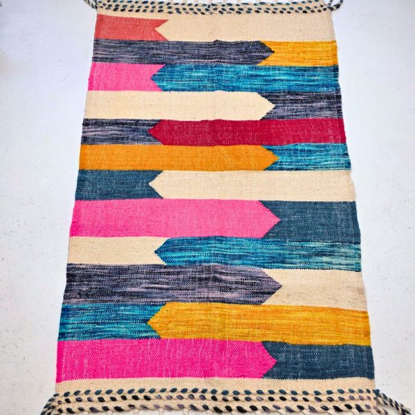 Minimalistic Moroccan Azilal rug with bold geometric patterns in white, brown, blue and multicolor wool, featuring abstract Berber tribal motifs and handwoven texture.