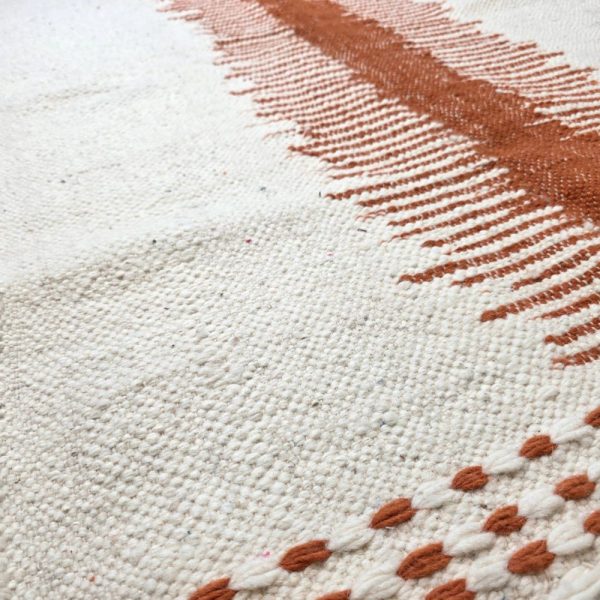 Minimalistic Moroccan Azilal rug with bold geometric patterns in white and brown wool, featuring abstract Berber tribal motifs and handwoven texture.