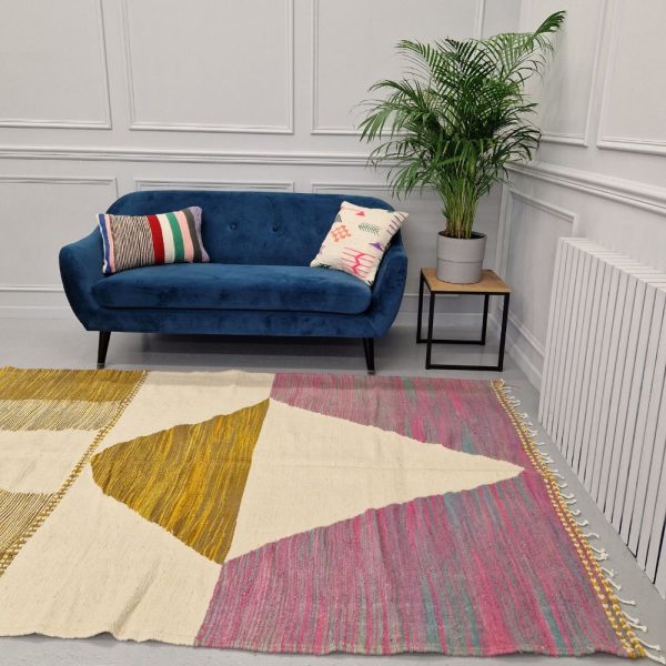 Colorful Moroccan rug with bold geometric patterns in orange, brown, pirple and multicolor wool, featuring abstract Berber tribal motifs and handwoven texture.