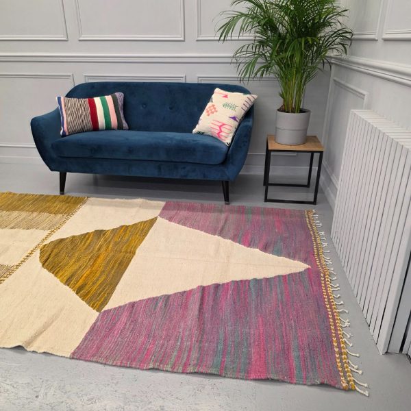 Colorful Moroccan rug with bold geometric patterns in orange, brown, pirple and multicolor wool, featuring abstract Berber tribal motifs and handwoven texture.