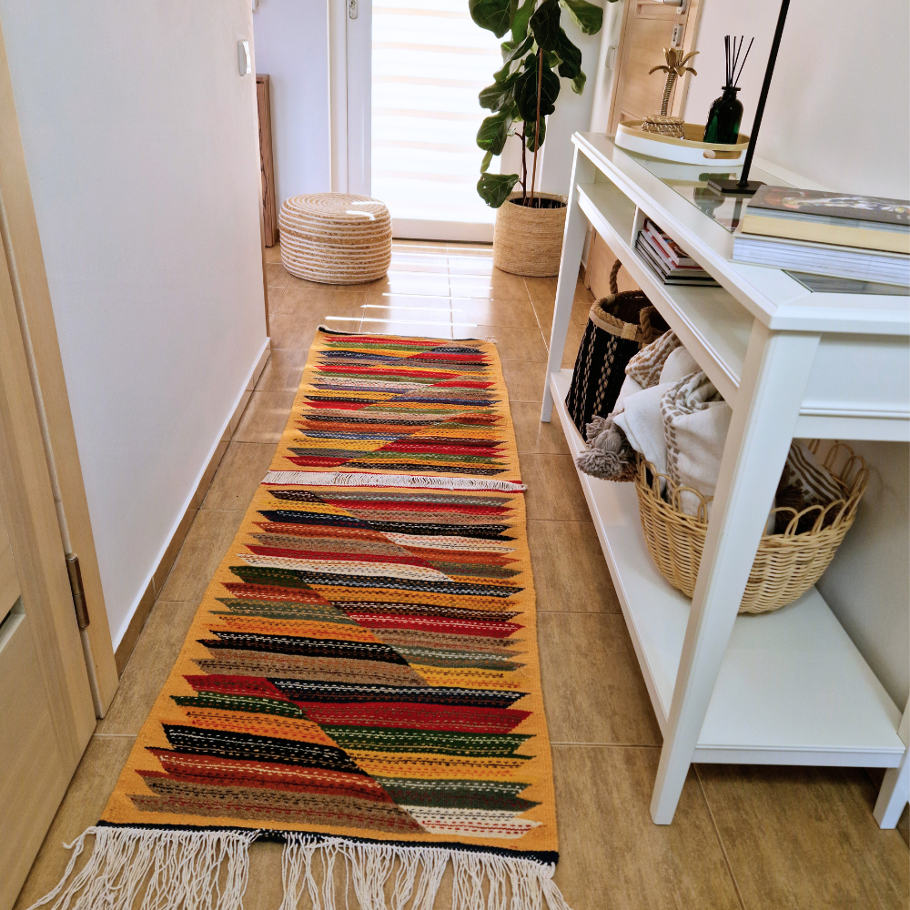 Bohemian Moroccan Azilal rug with bold geometric patterns in red, blue, white and multicolor wool, featuring abstract Berber tribal motifs and handwoven texture.