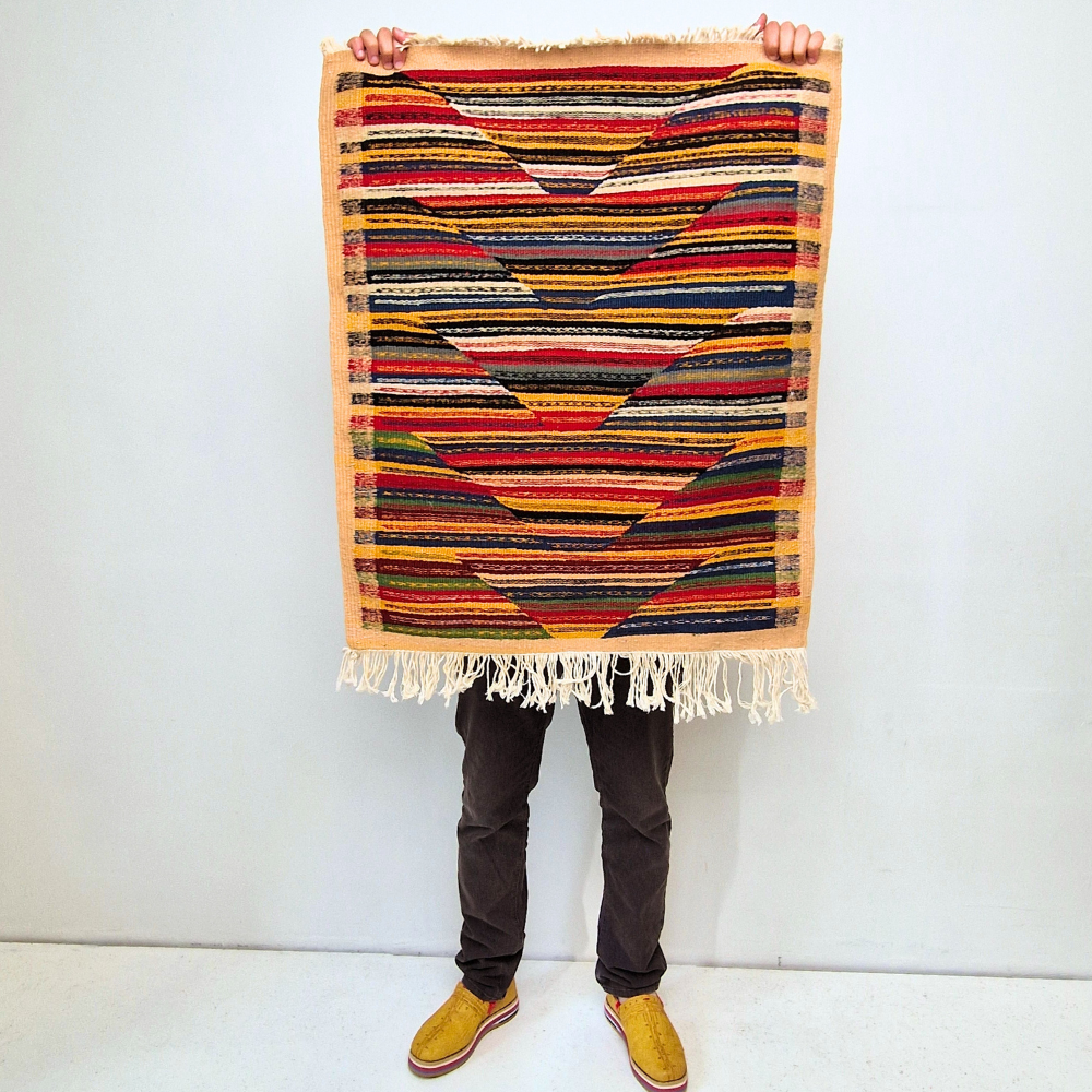 Bohemian Moroccan Azilal rug with bold geometric patterns in red, orange, purple, and multicolor wool, featuring abstract Berber tribal motifs and handwoven texture.