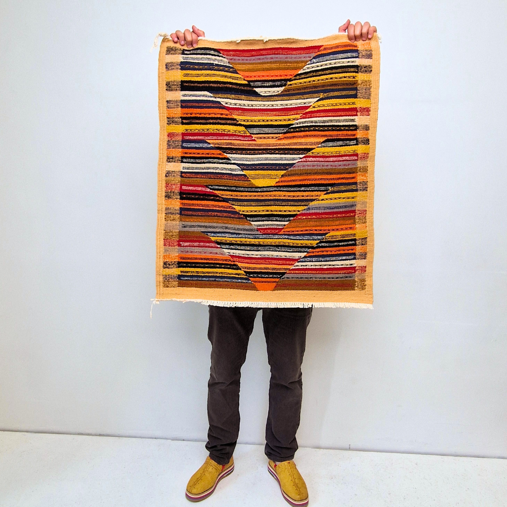 Bohemian Moroccan Azilal rug with bold geometric patterns in red, orange, purple, and multicolor wool, featuring abstract Berber tribal motifs and handwoven texture.