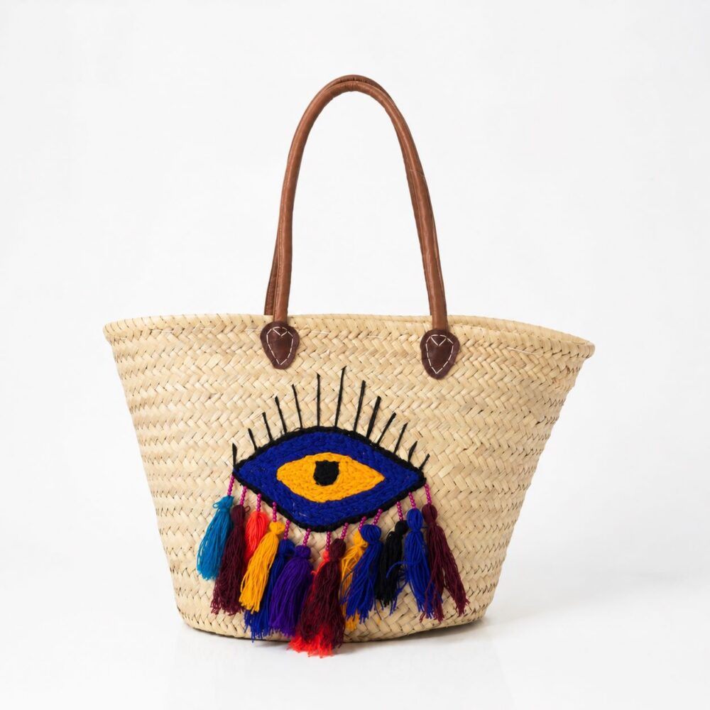 Moroccan evil eye basket bag with cobalt embroidery, multicolour tassels, and leather handles