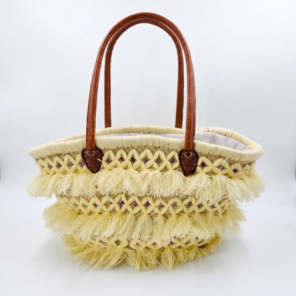 Butter tassel basket bag with soft yellow fringe, pink crystal beads, and leather handles