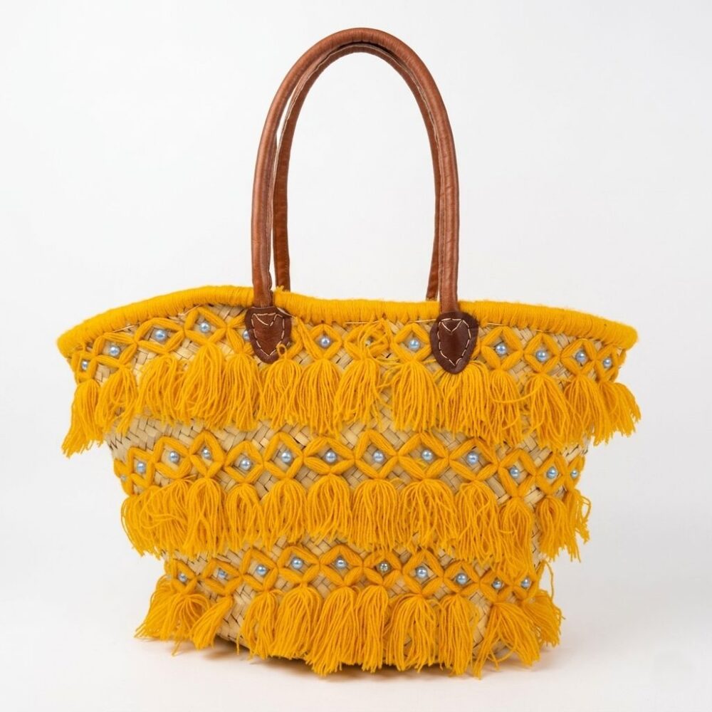 Moroccan mustard basket bag with yellow macramé thread, blue pearl beads, and leather handles