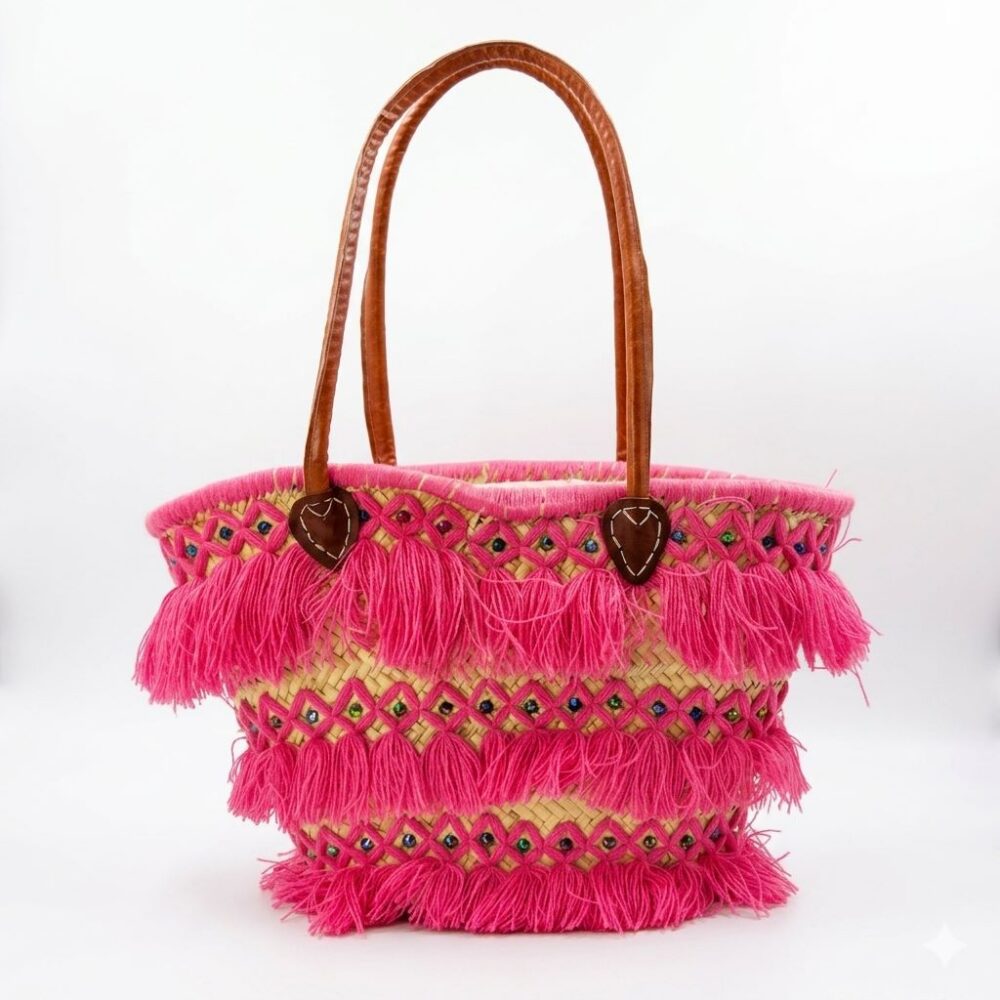 Pink tassel basket bag with fuchsia fringe, multicolor beads, and leather handles