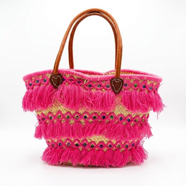 Pink tassel basket bag with fuchsia fringe, multicolor beads, and leather handles