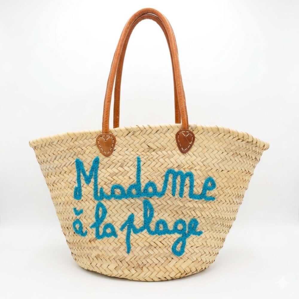 Beach quote basket bag with "Madame à la Plage" hand-stitched in teal thread and leather handles