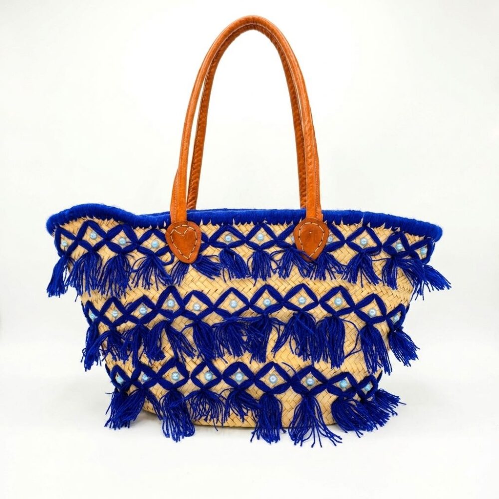 Blue tassel basket bag with royal blue fringe, pearl beads, and leather handles